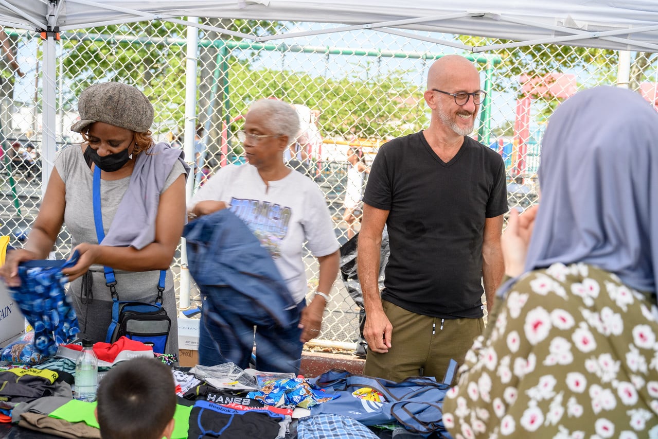 Volunteers distributing clothing and essentials at a Queens Community Closet event